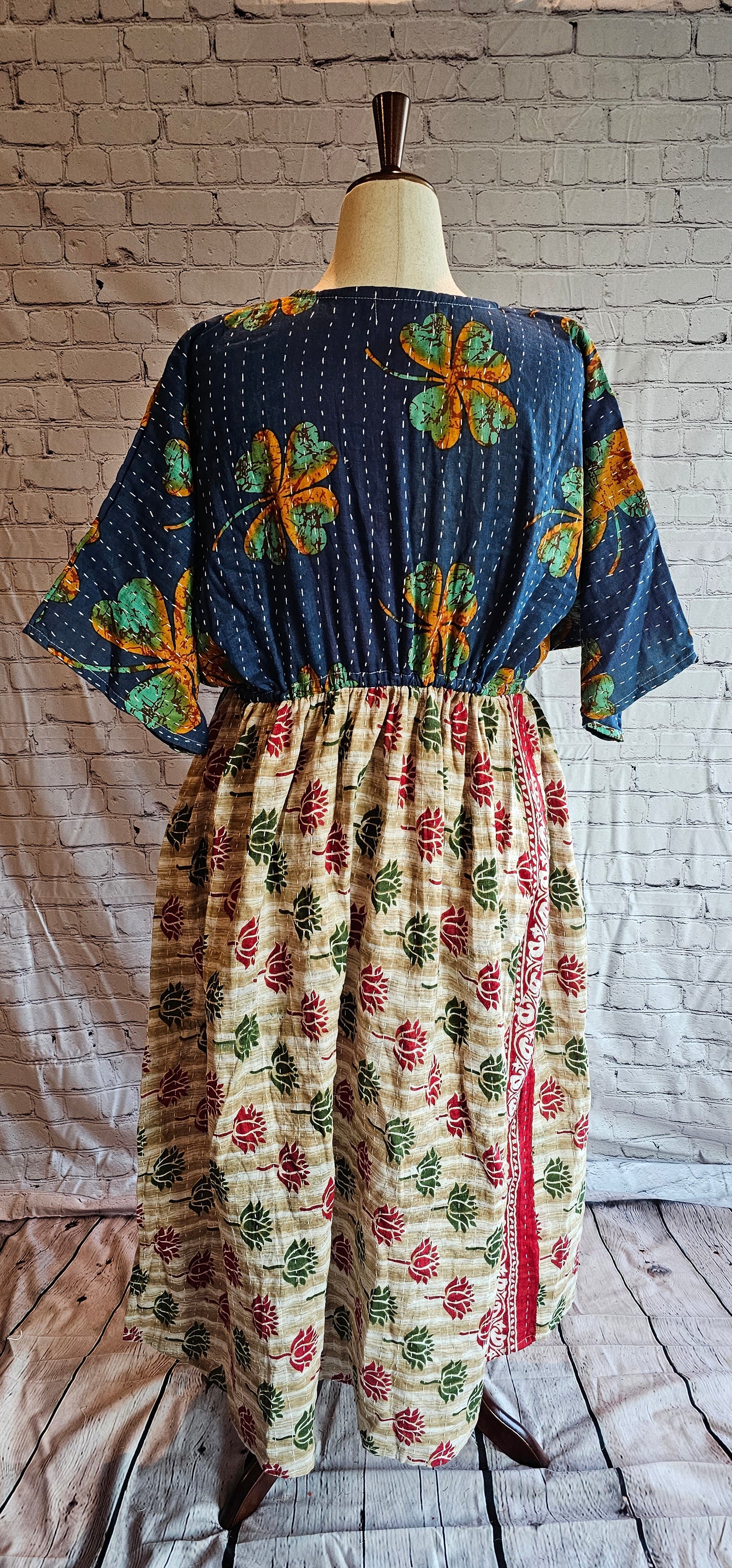 Kantha stitching on Mosswynd cotton dress, made from recycled sari fabric shown on mannequin.