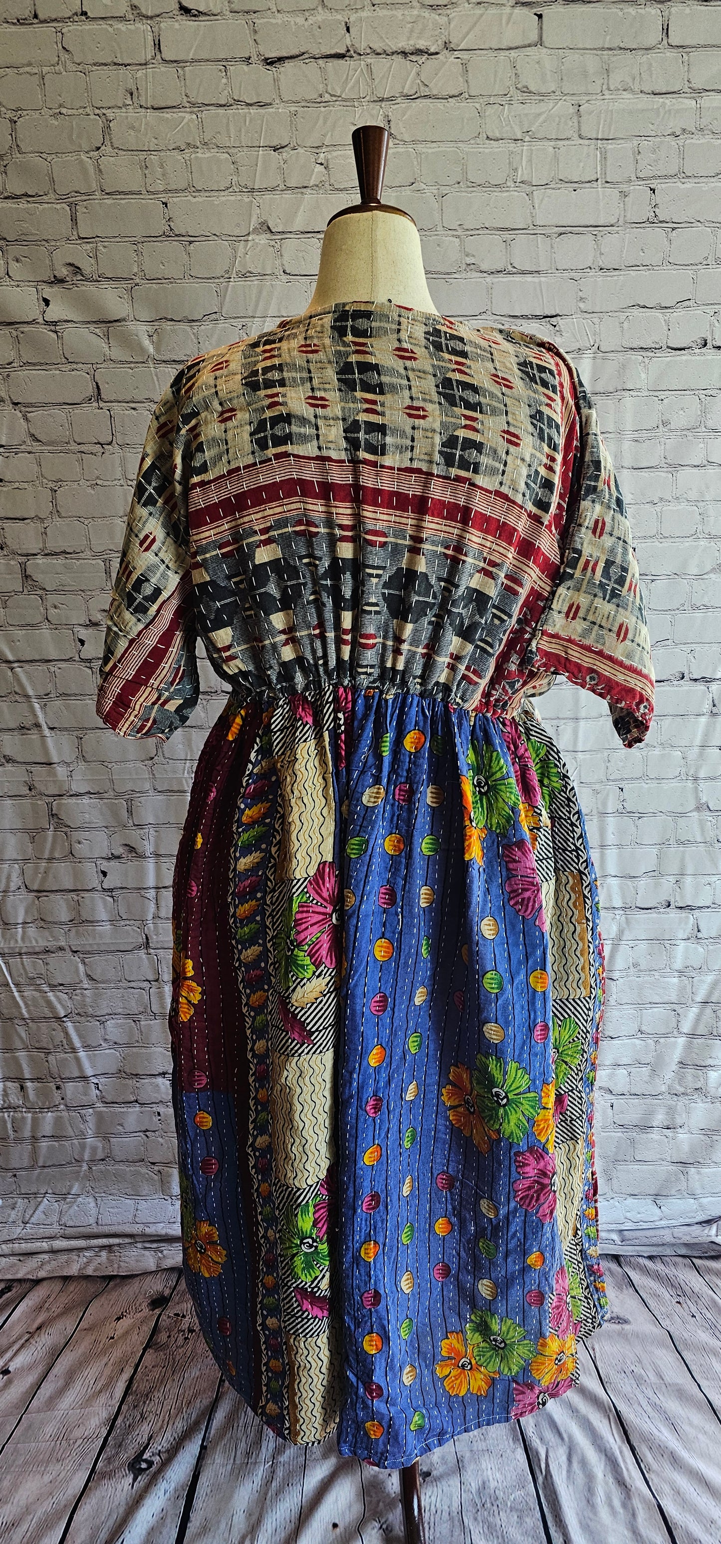 Sustainable cotton Kantha dress for boho wardrobe, eco-conscious and shown on mannequin.