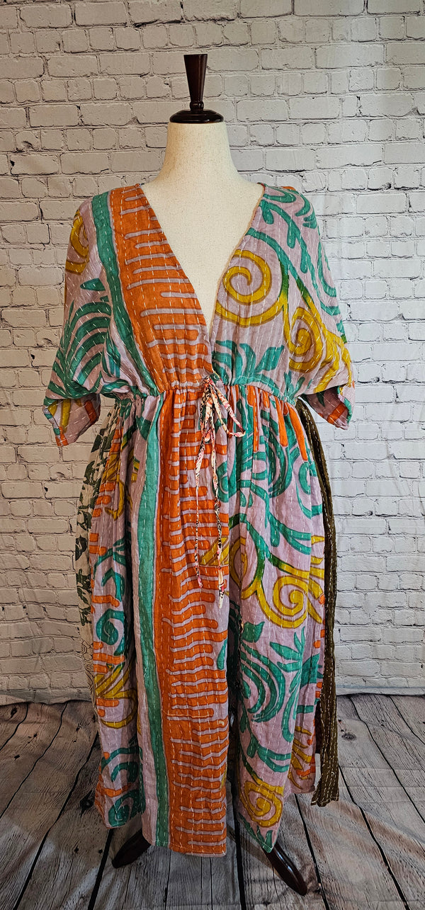 Mosswynd cotton Kantha dress, bohemian patchwork design with flowing fit shown on mannequin.
