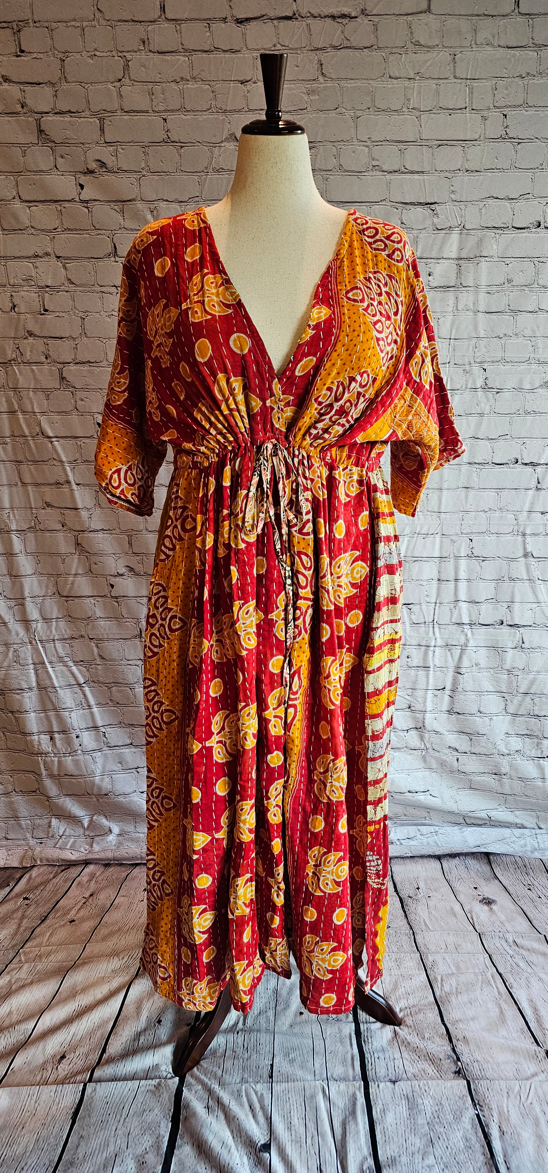 Bohemian cotton Kantha dress styled casually, one-of-a-kind patchwork garment shown on mannequin.