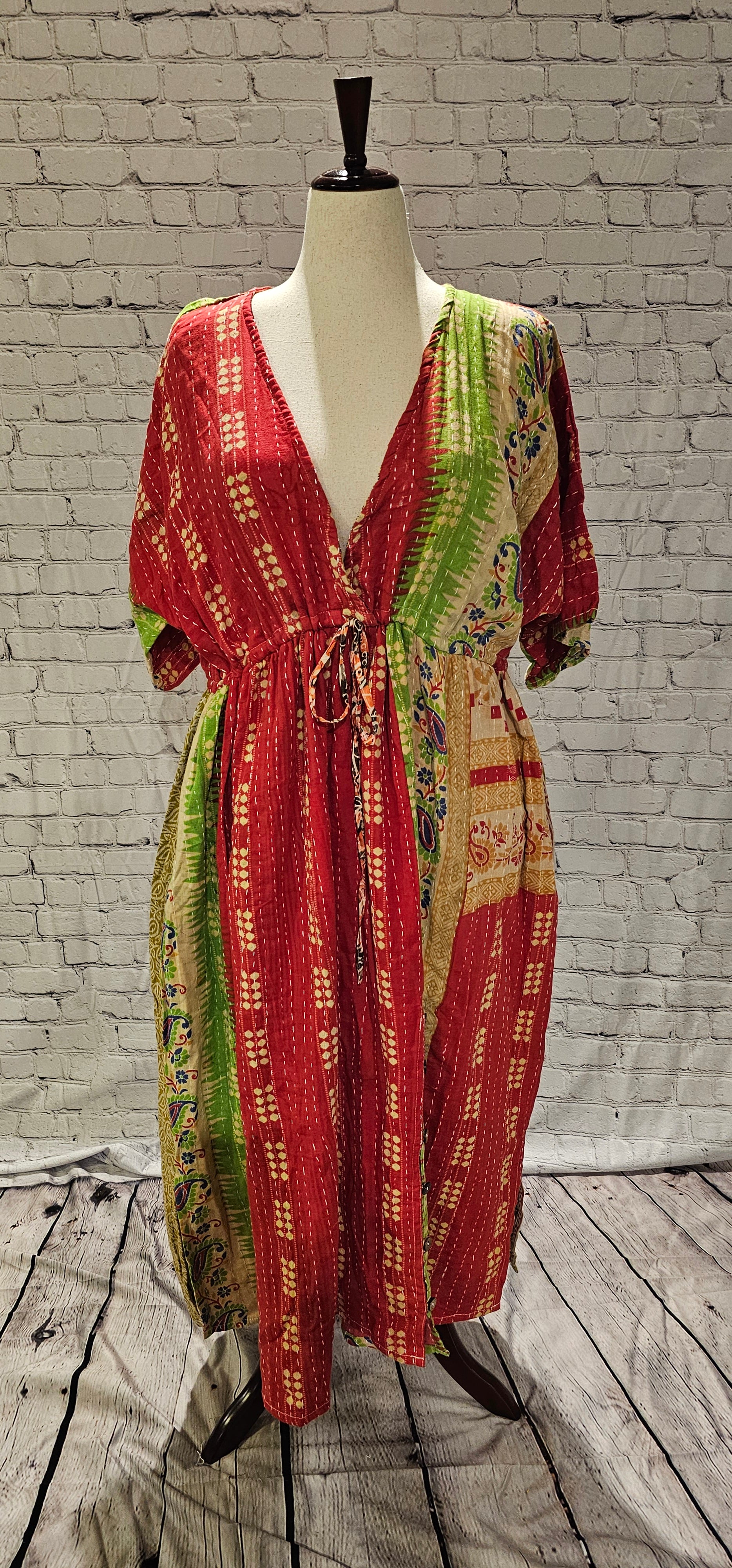 Mosswynd cotton Kantha dress, bohemian patchwork design with flowing fit shown on mannequin.