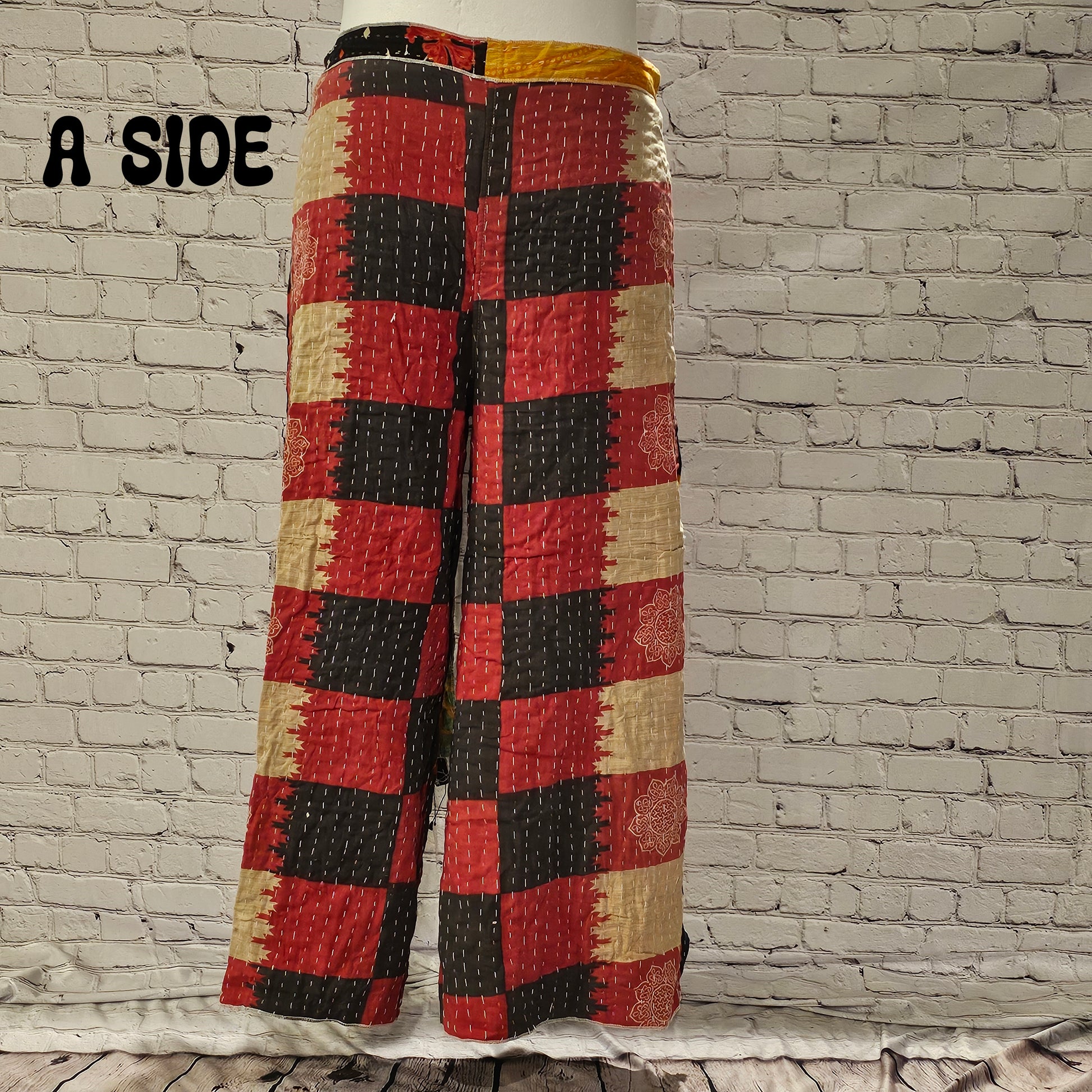 Front view of Ronin Kantha unisex wrap pants, made from recycled sari fabric in boho patchwork design.