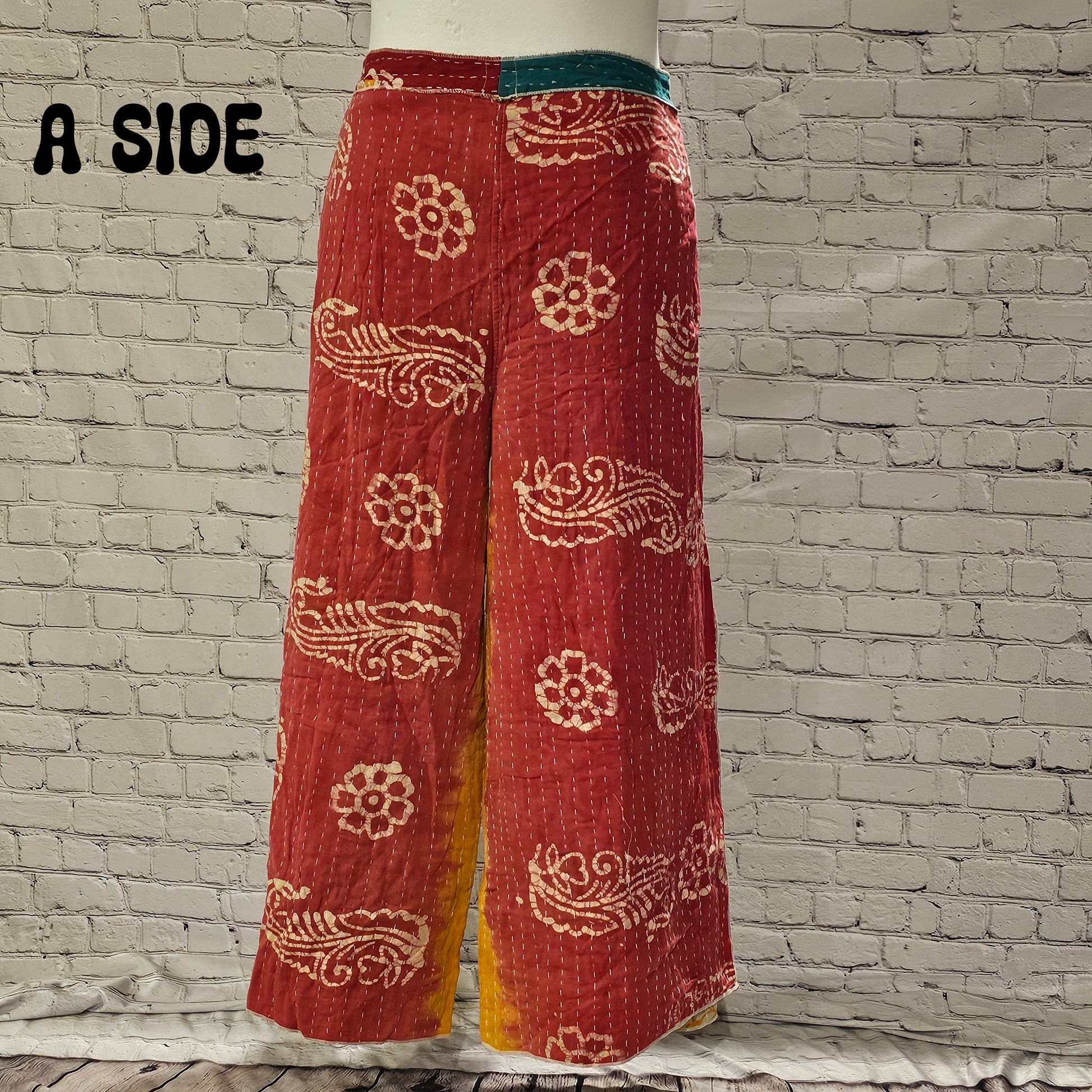 Front view of Ronin Kantha unisex wrap pants, made from recycled sari fabric in boho patchwork design.