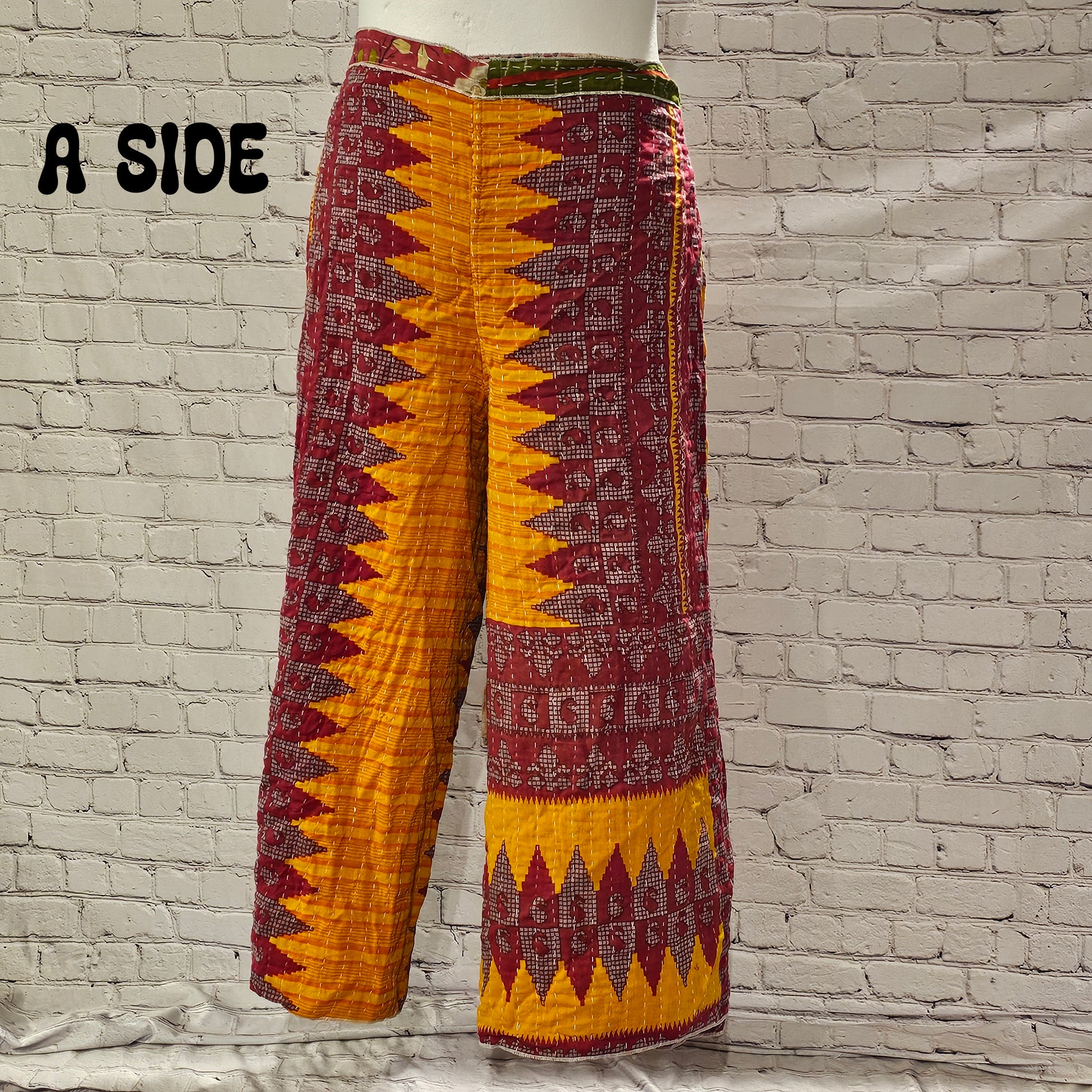 Front view of Ronin Kantha unisex wrap pants, made from recycled sari fabric in boho patchwork design.