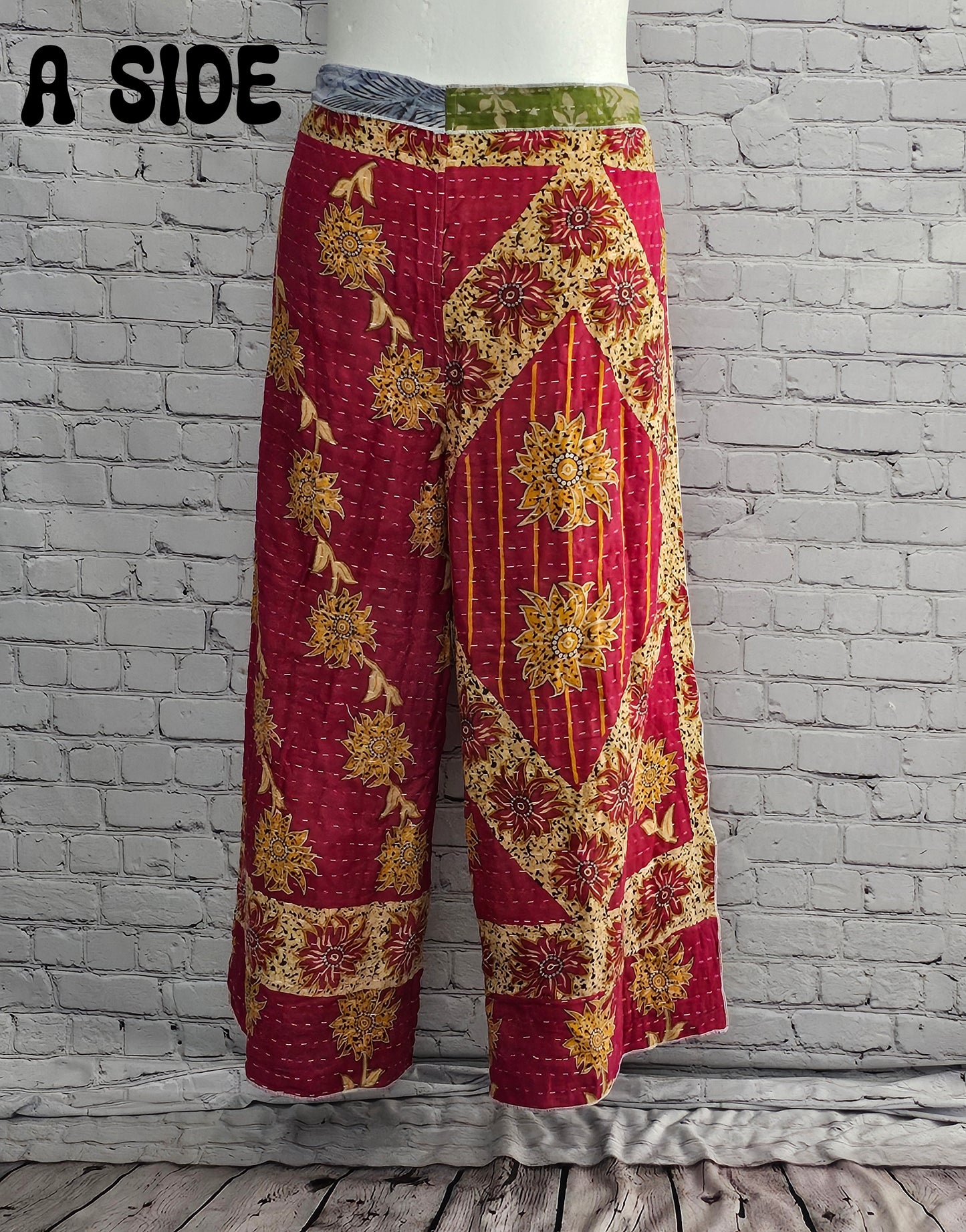 Front view of Ronin Kantha unisex wrap pants, made from recycled sari fabric in boho patchwork design.