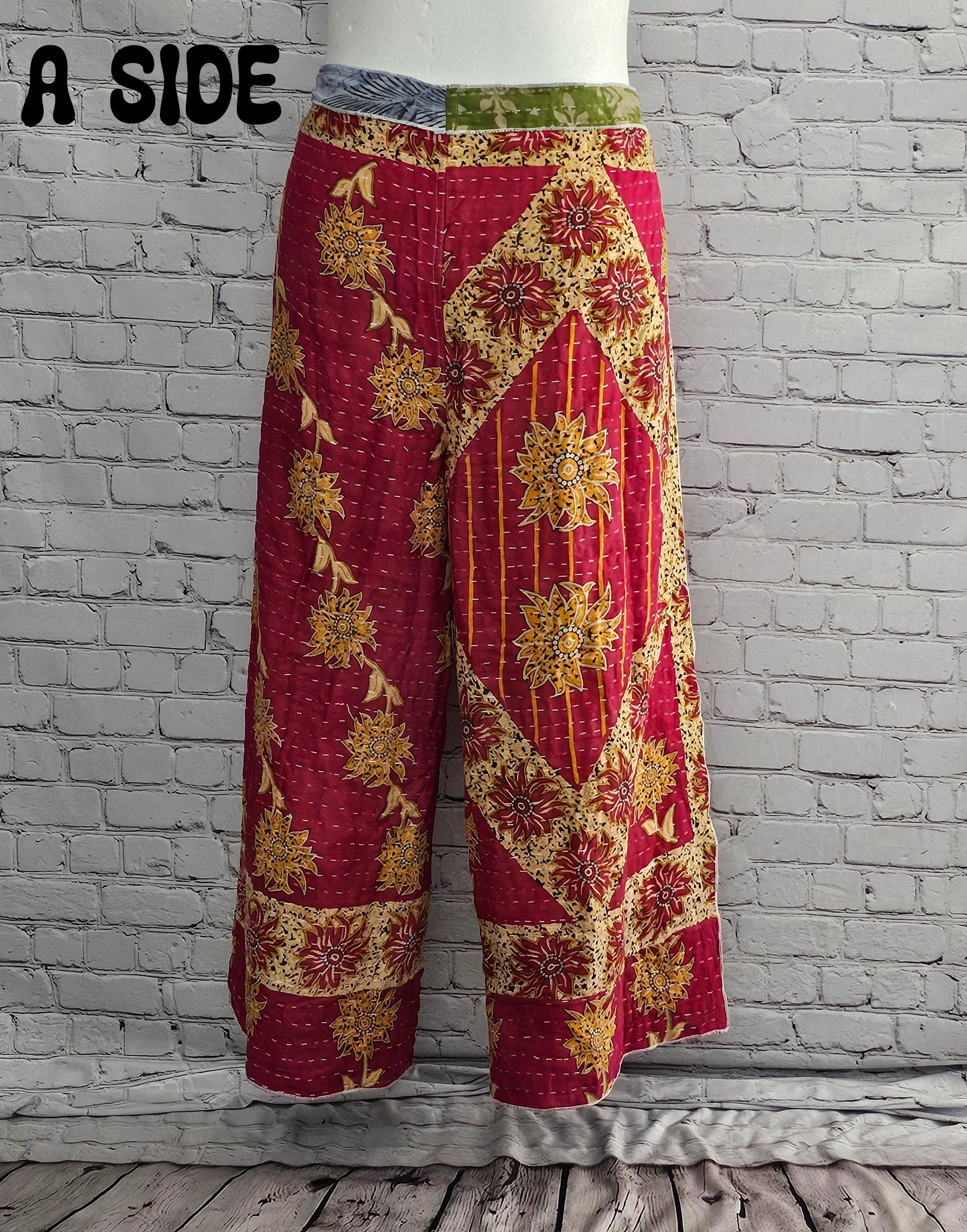 Front view of Ronin Kantha unisex wrap pants, made from recycled sari fabric in boho patchwork design.