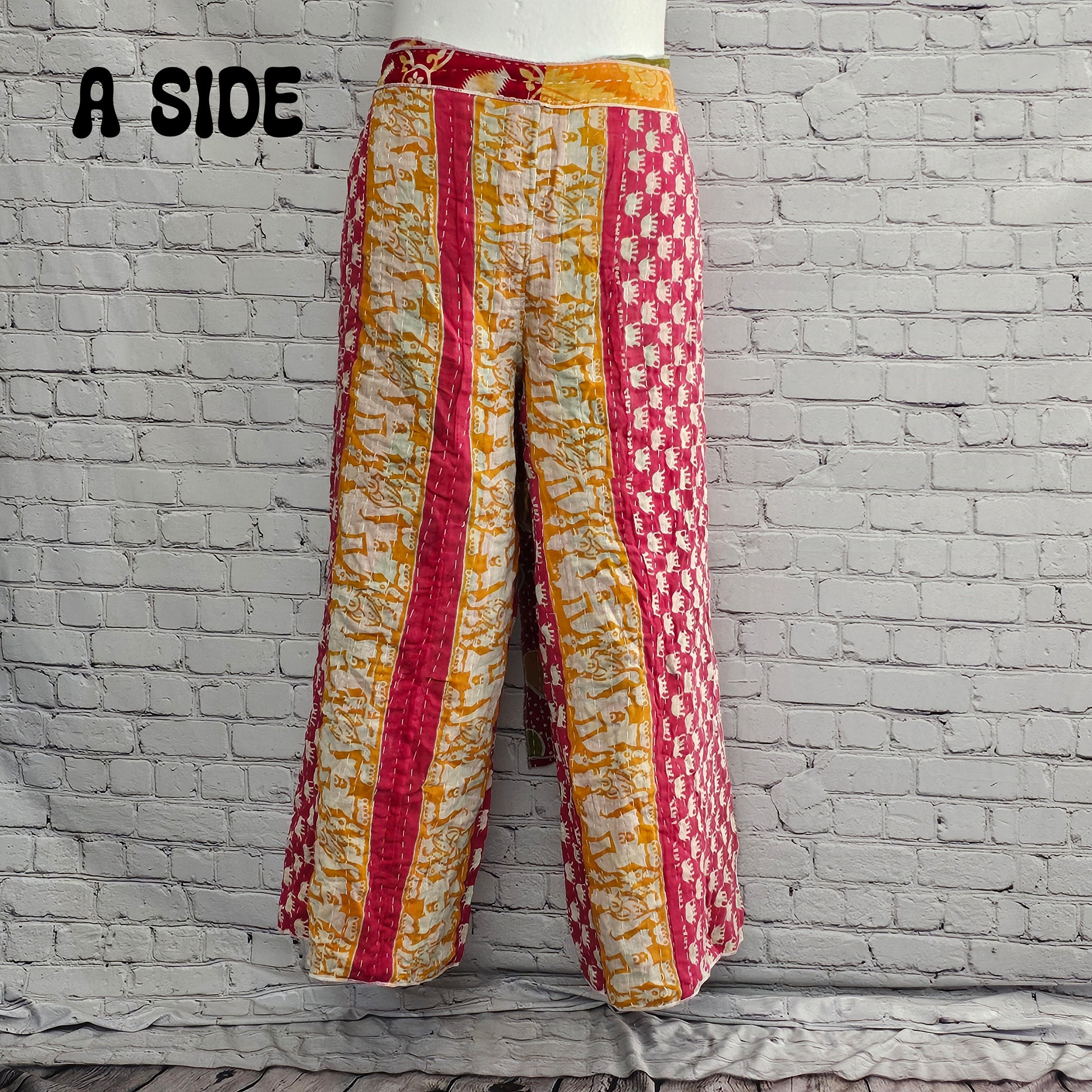 Back view of Ronin Kantha unisex wrap pants, recycled sari patchwork design in boho style.