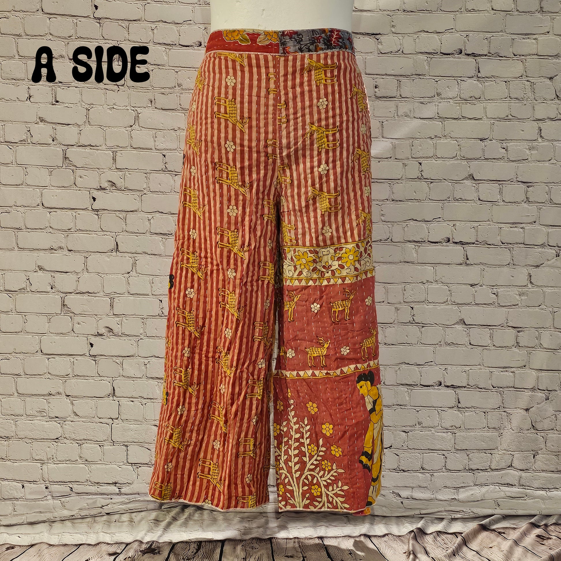 Front view of Ronin Kantha unisex wrap pants, made from recycled sari fabric in boho patchwork design.