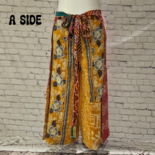 Front view of Ronin Kantha unisex wrap pants, made from recycled sari fabric in boho patchwork design.