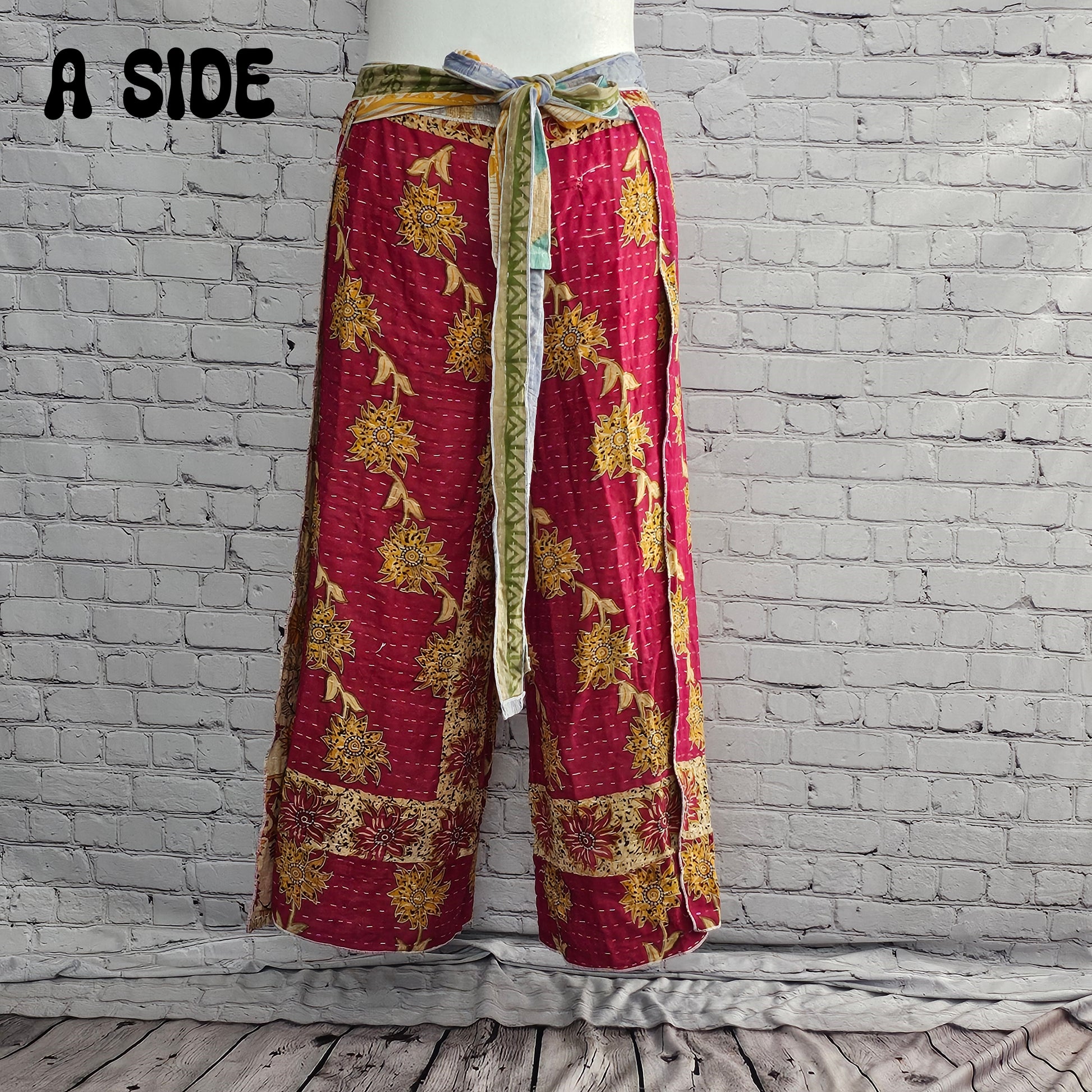 Front view of Ronin Kantha unisex wrap pants, made from recycled sari fabric in boho patchwork design.