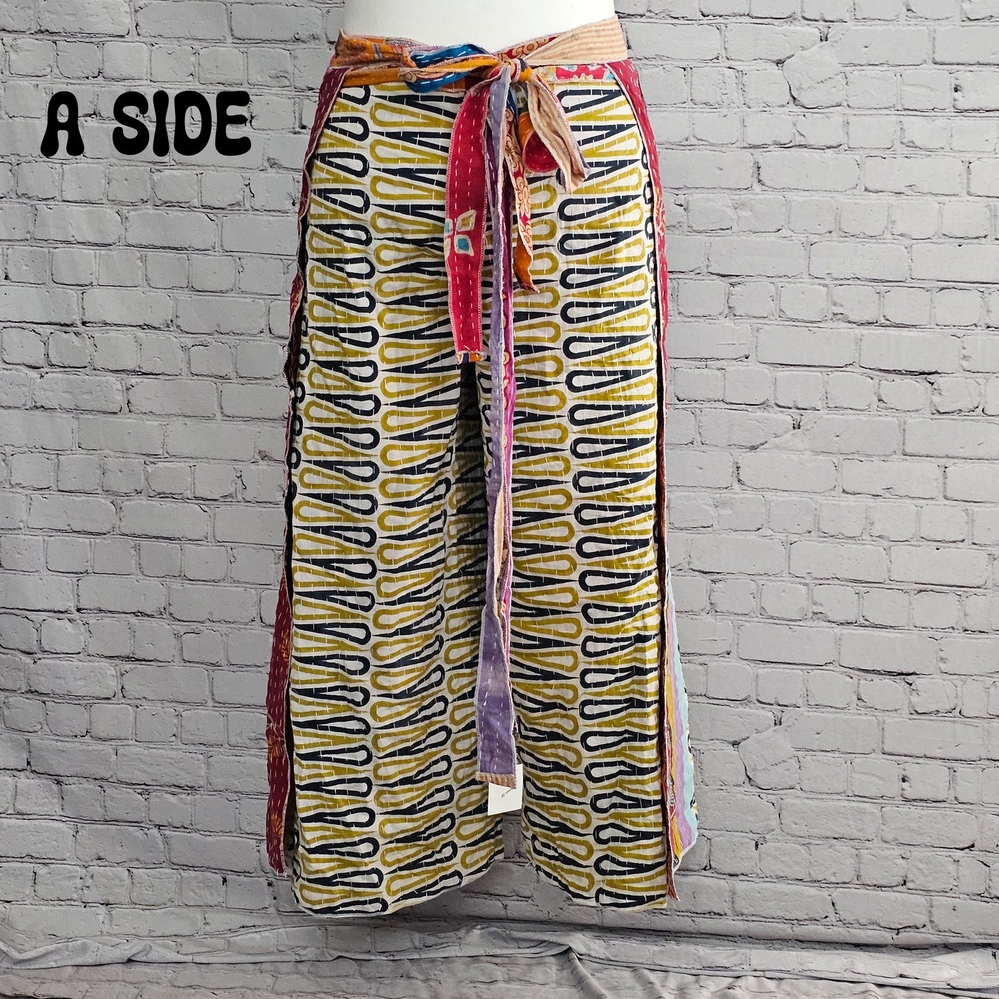 Bohemian reversible Kantha wrap pants on model, eco-friendly unisex loungewear.