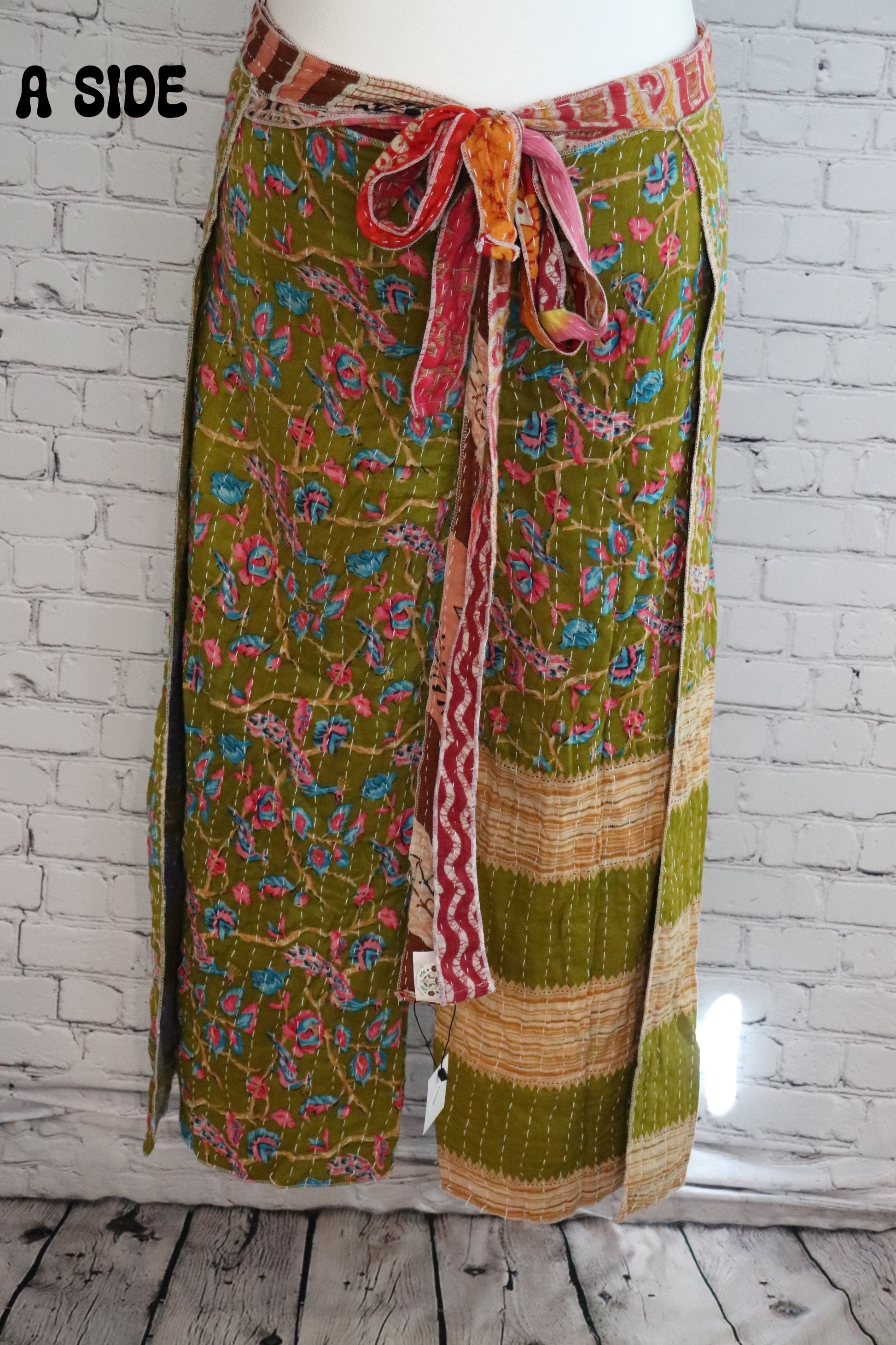 Front view of Ronin Kantha unisex wrap pants, made from recycled sari fabric in boho patchwork design.