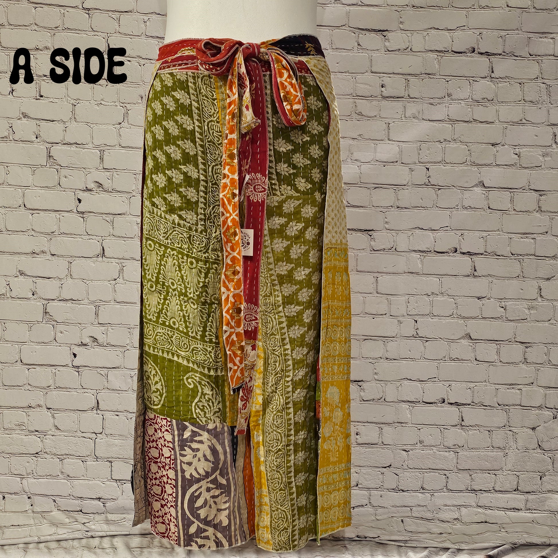 Front view of Ronin Kantha unisex wrap pants, made from recycled sari fabric in boho patchwork design.