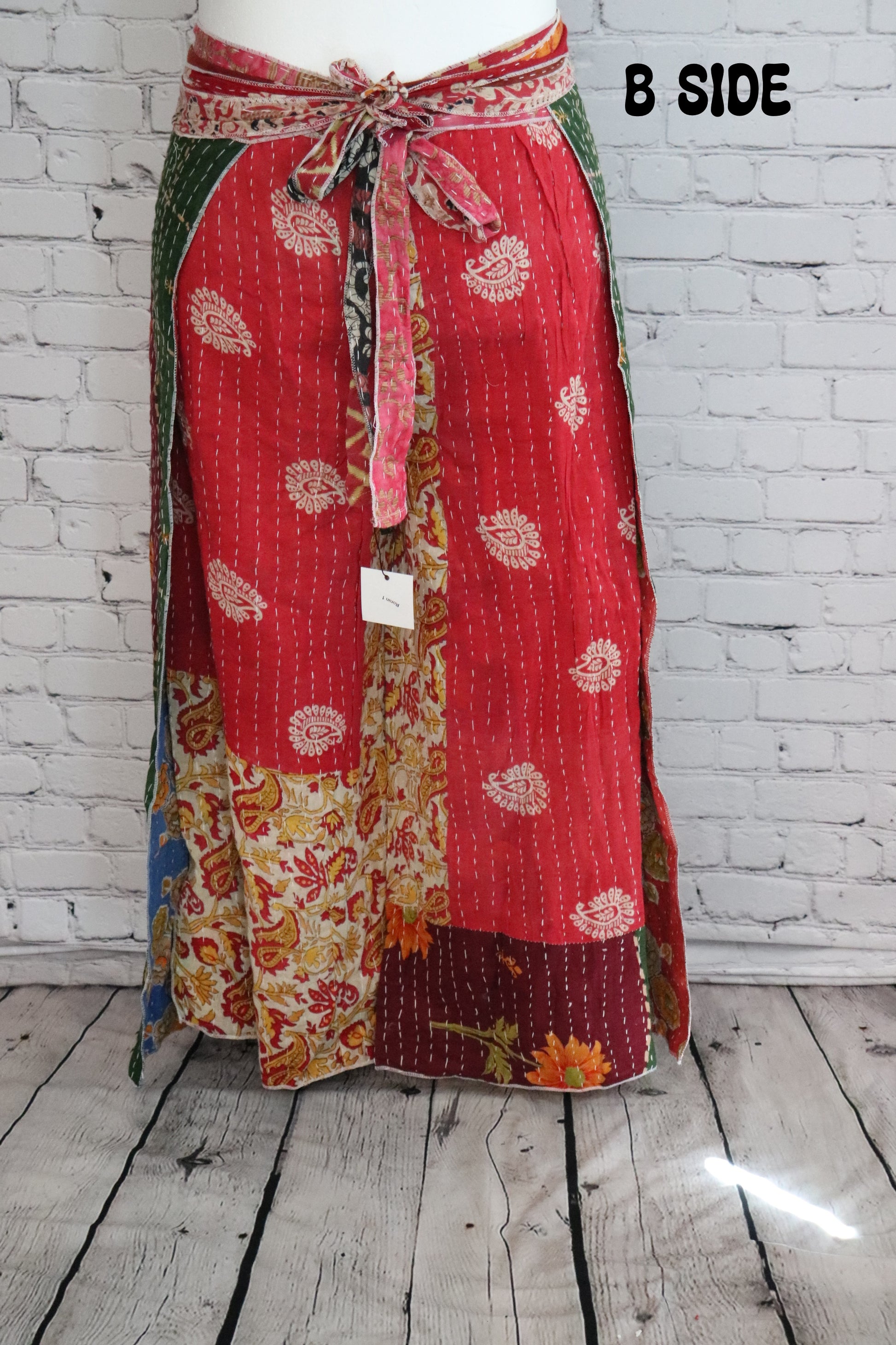 Front view of Ronin Kantha unisex wrap pants, handmade from recycled sari fabric in boho patchwork design.