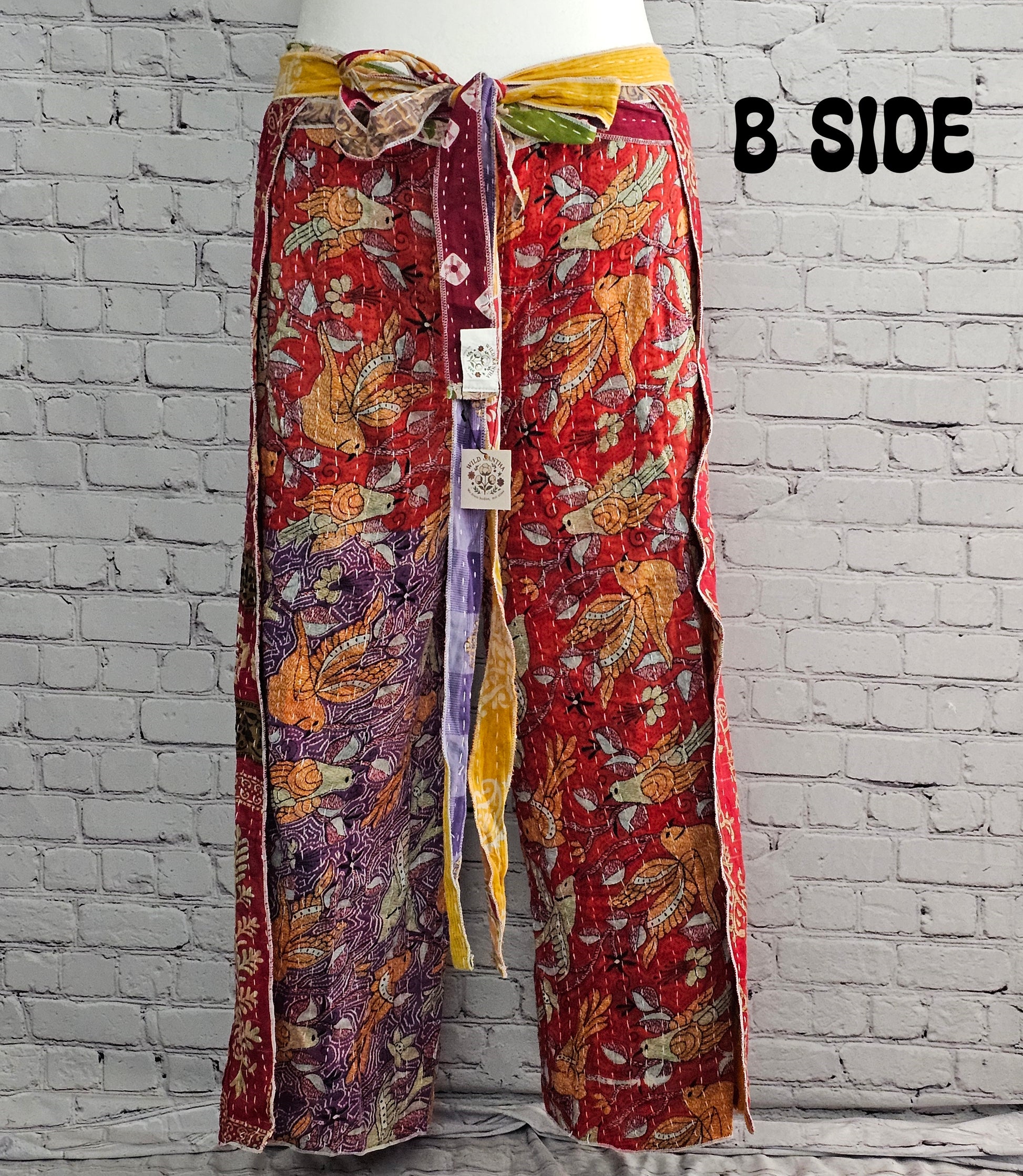 Front view of Ronin reversible boho Kantha wrap pants, handmade from recycled sari fabric.