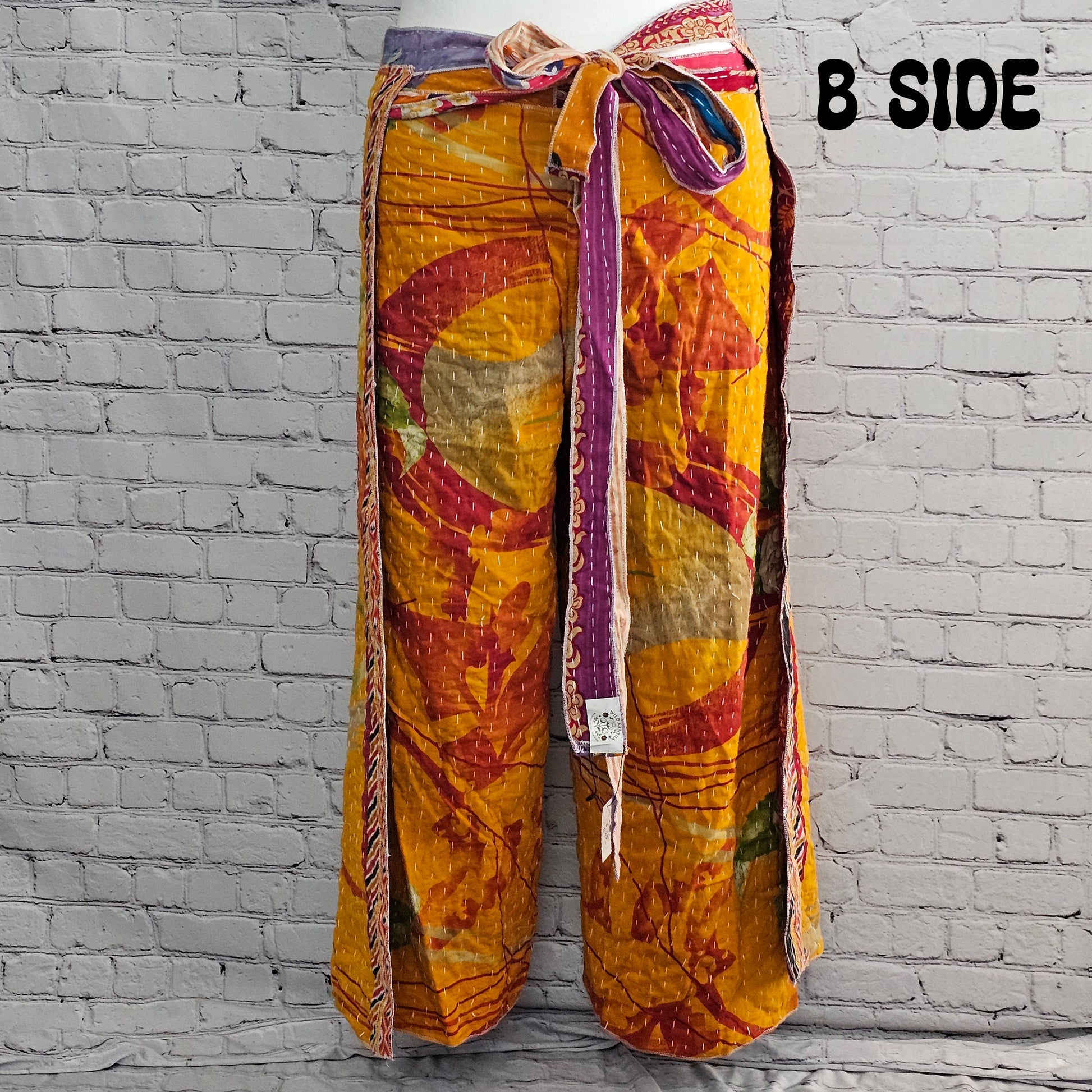 Bohemian reversible Kantha wrap pants on model, eco-friendly unisex loungewear.